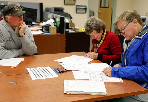 Three volunteers take part in Logic and Accuracy Testing for the for June 25 Primary Mail Ballot Election.