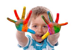 kid with painted hands