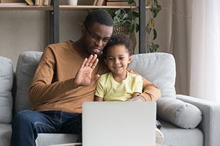 adult and child on video call